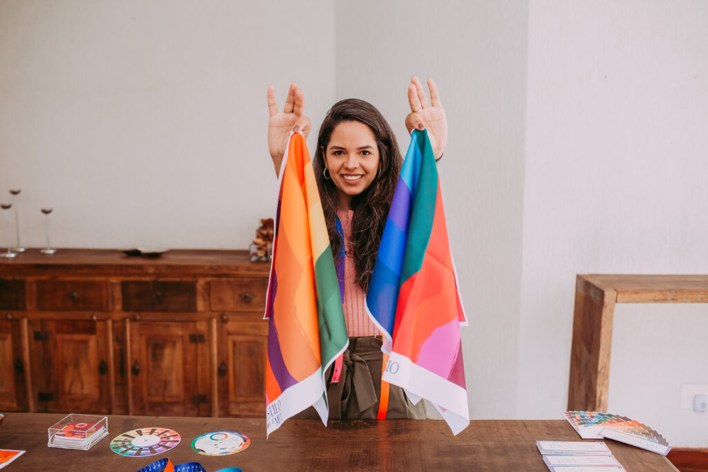 Smiling woman showing color palettes on handkerchiefs