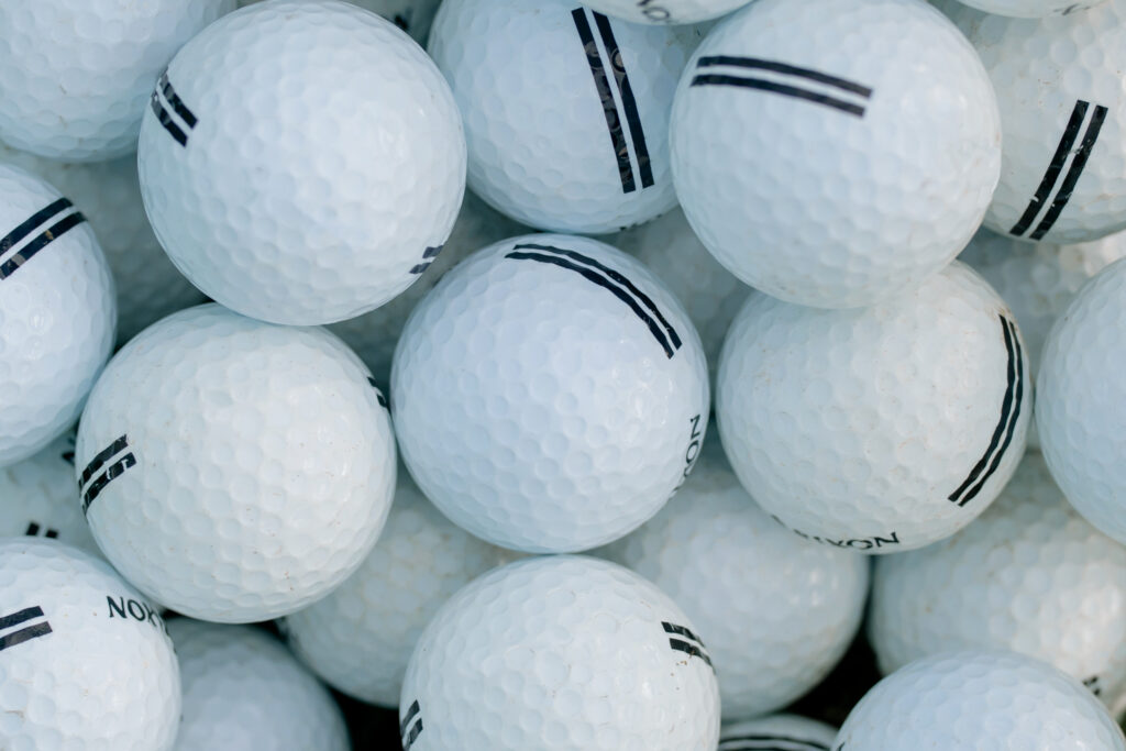 White golf balls in close up photography