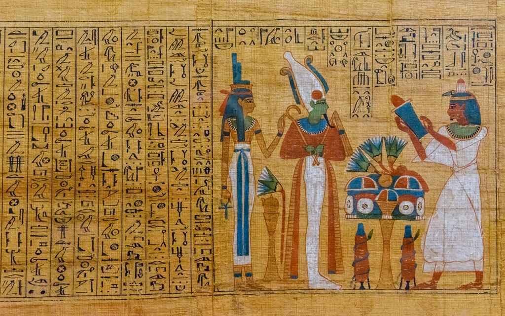 Egyptian ancient papyrus with the different pictures and hieroglyphics